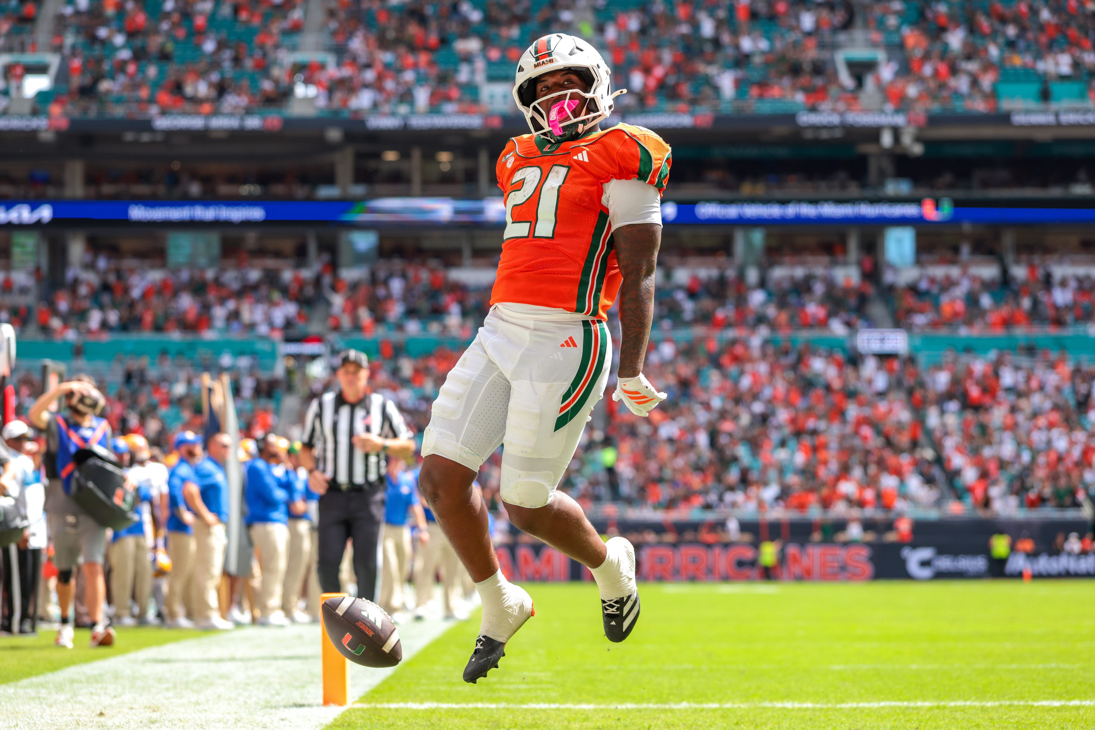 Oct 24, 2026; Miami Gardens, Florida, USA; Miami Hurricanes running back Javian Mallory (21) scores a touchdown against the Pittsburgh Panthers during the second quarter at Hard Rock Stadium. Mandatory Credit: Sam Navarro-Imagn Images