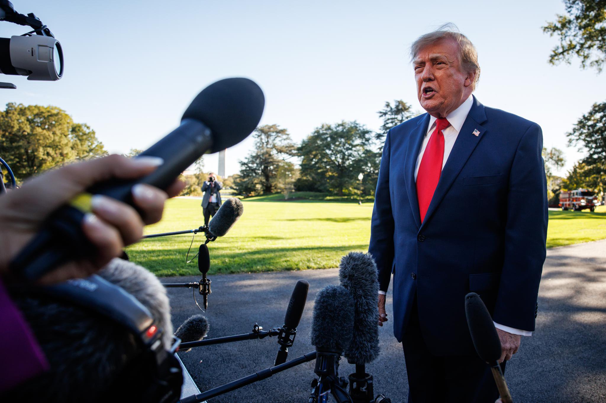 Donald Trump speaks with reporters on the South Lawn of the White House.