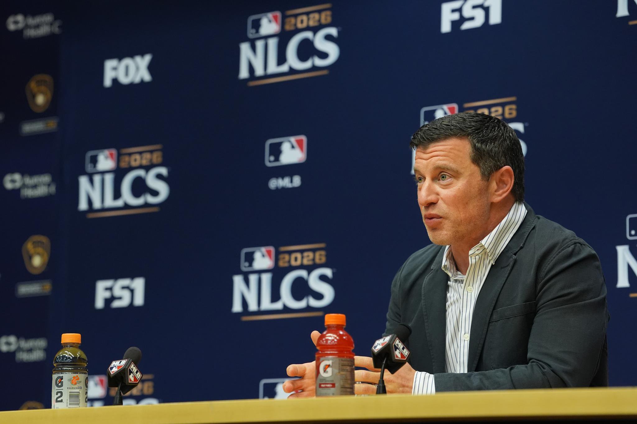 A man speaks at a press conference during the National League Championship Series.