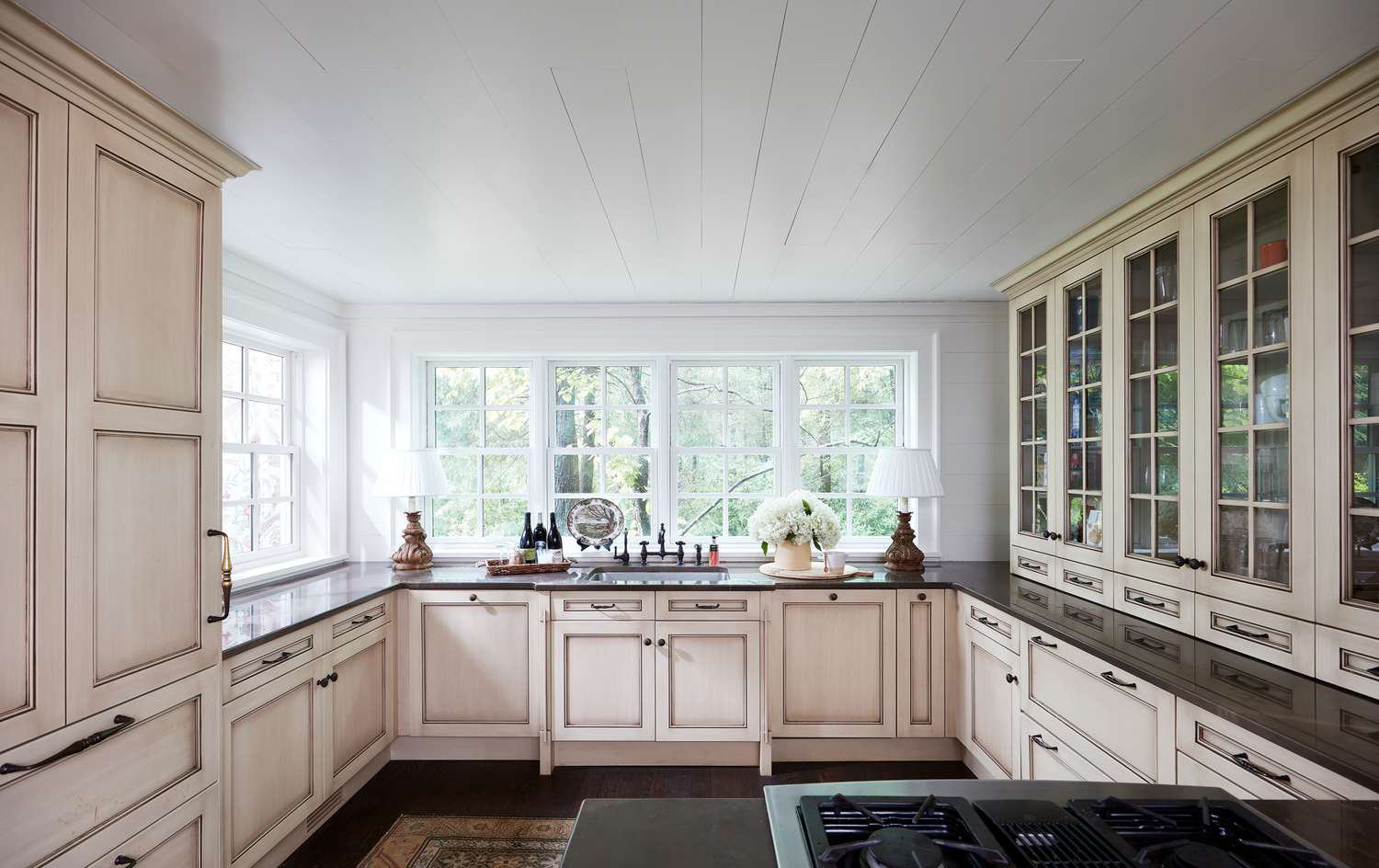 tall glass cabinets in bright kitchen