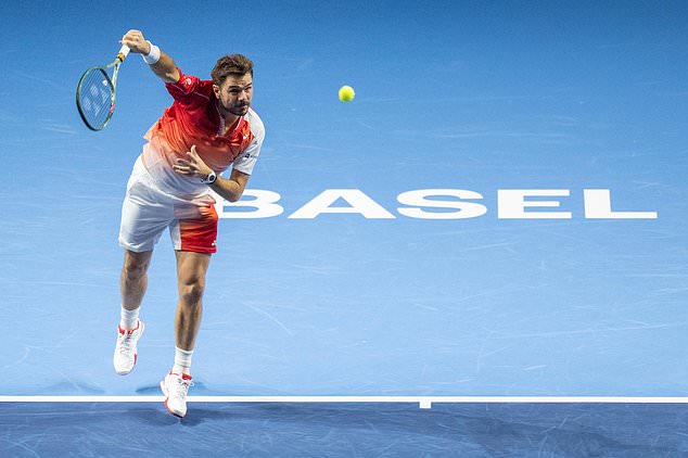 Switzerland's Stan Wawrinka serves to Czech Republic's Jiri Lehecka during the first round of the Swiss Indoors tennis tournament in Basel, Switzerland, Tuesday, Oct. 27, 2026. (Georgios Kefalas/Keystone via AP)