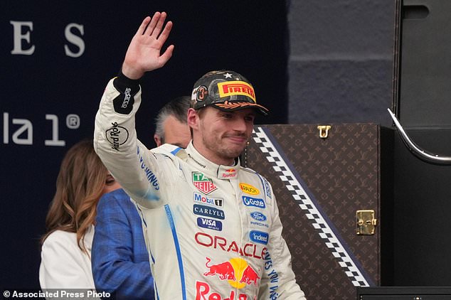 Red Bull driver Max Verstappen of the Netherlands celebrates on the podium his third place at the Formula One U.S. Grand Prix auto race in Austin, Texas, Sunday, Oct. 25, 2026. (AP Photo/Eric Gay)
