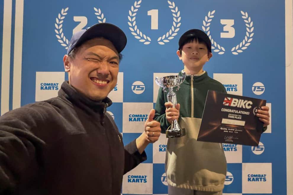 Proud dad Bill Lai and his son Nico, 11, who is celebrating qualifying for the national finals of the British Indoor Karting Championship – which take place next month (Photo: Submitted)