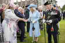 Her Majesty opted for a stunning long sleeve dress with a lengthy floral pattern at its centre and white leather gloves