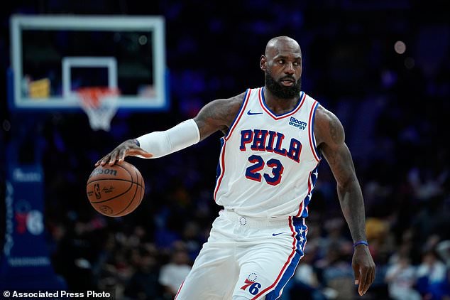 Philadelphia 76ers' LeBron James dribbles during the second half of a preseason NBA basketball game against the Boston Celtics Friday, Oct. 16, 2026, in Philadelphia. (AP Photo/Matt Slocum)