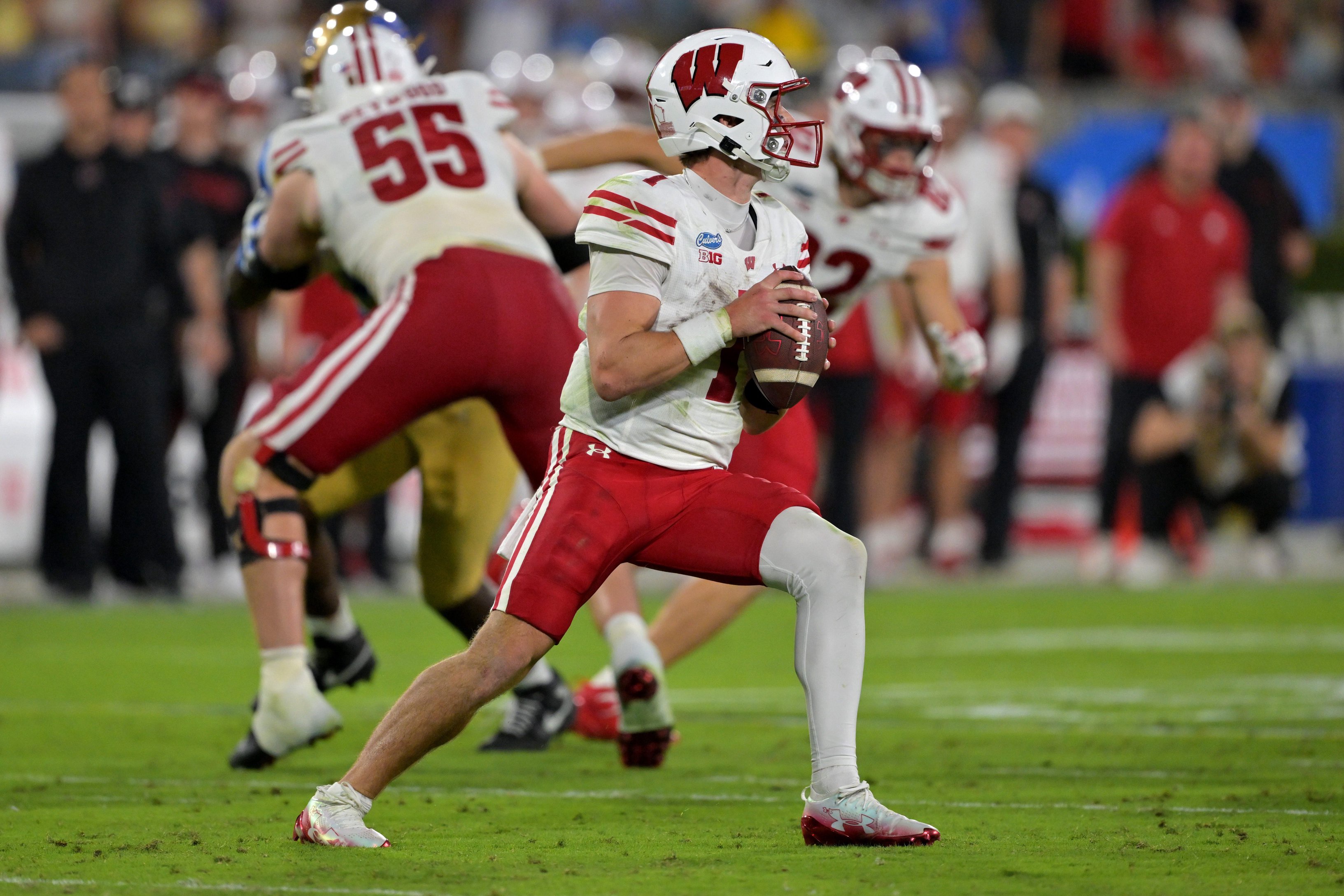 Oct 17, 2026; Pasadena, California, USA;  Wisconsin Badgers quarterback Colton Joseph (1) sets to pass in the second half against the UCLA Bruins at the Rose Bowl. Mandatory Credit: Jayne Kamin-Oncea-Imagn Images