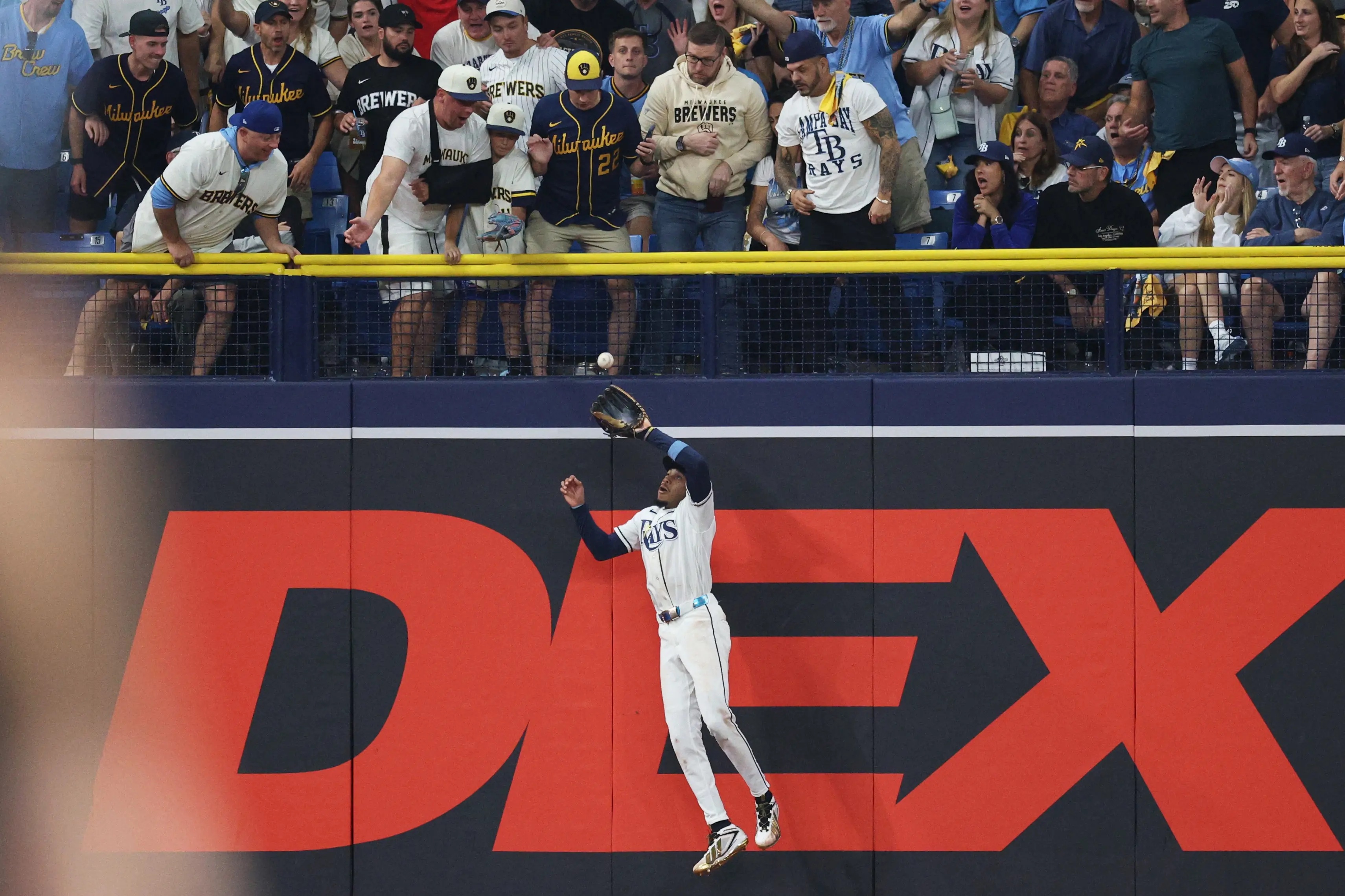 Chandler Simpson makes a catch at the wall