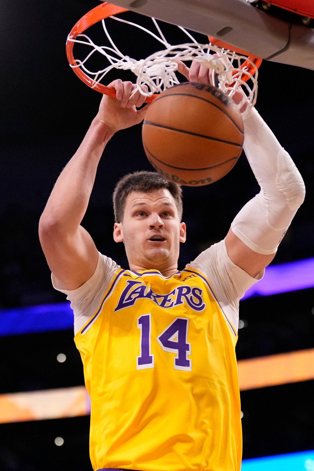 Los Angeles Lakers center Walker Kessler dunks the basketball.