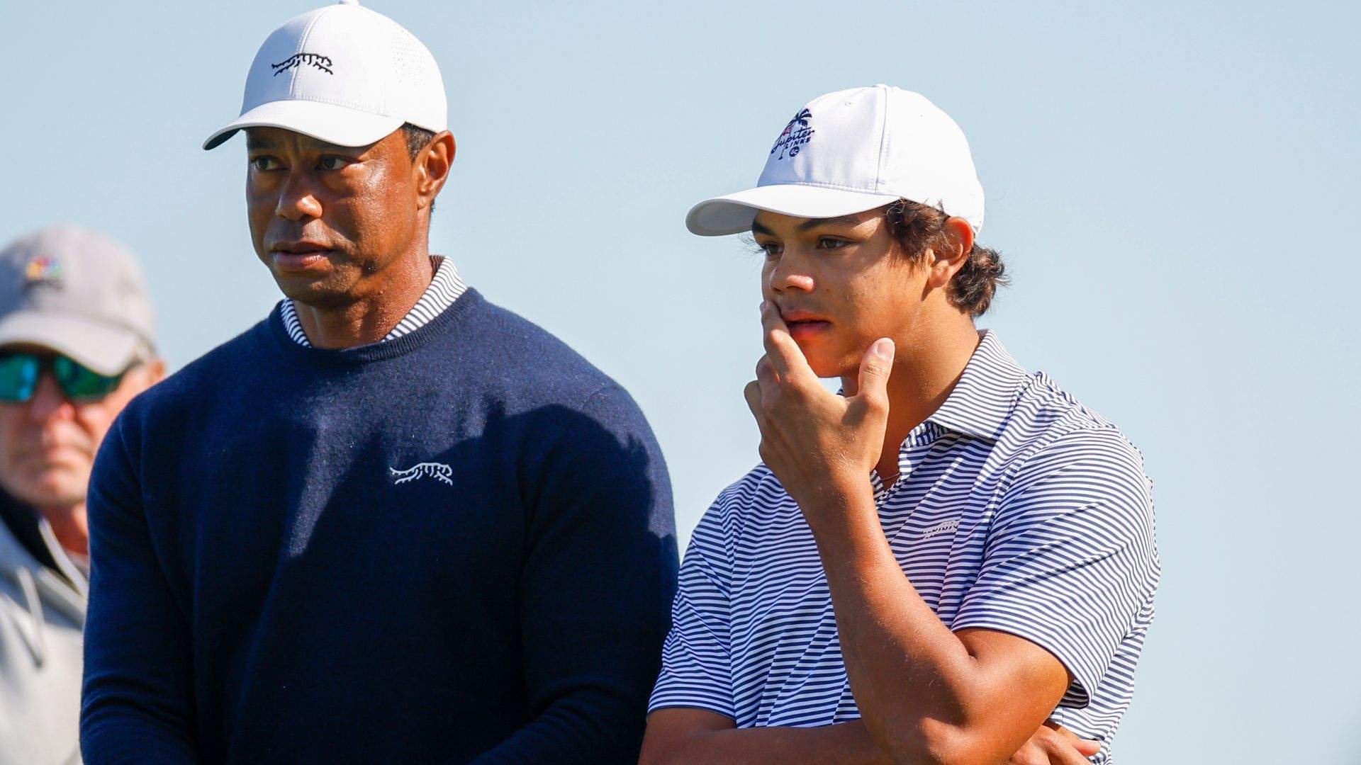 Tiger Woods talks with his son Charlie Woods while they play the second hole during the first round of the PNC Championship at Ritz-Carlton Golf Club on December 21, 2024 in Orlando, Florida