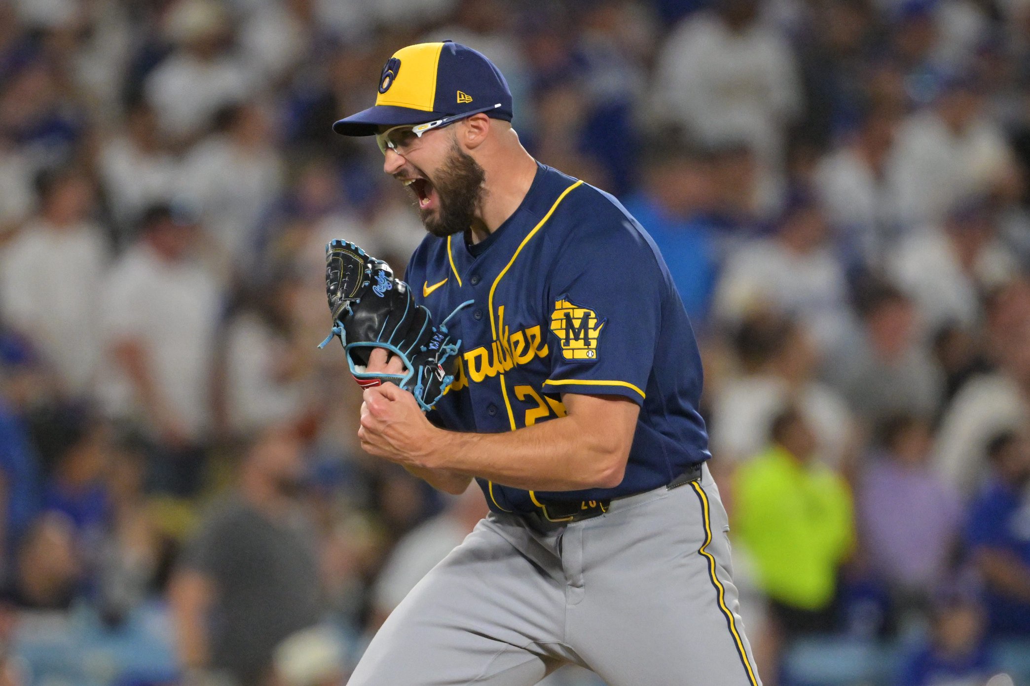 Milwaukee Brewers pitcher Aaron Ashby (26) reacts after defeating the Los Angeles Dodgers in Game 4 of the NLCS. 
