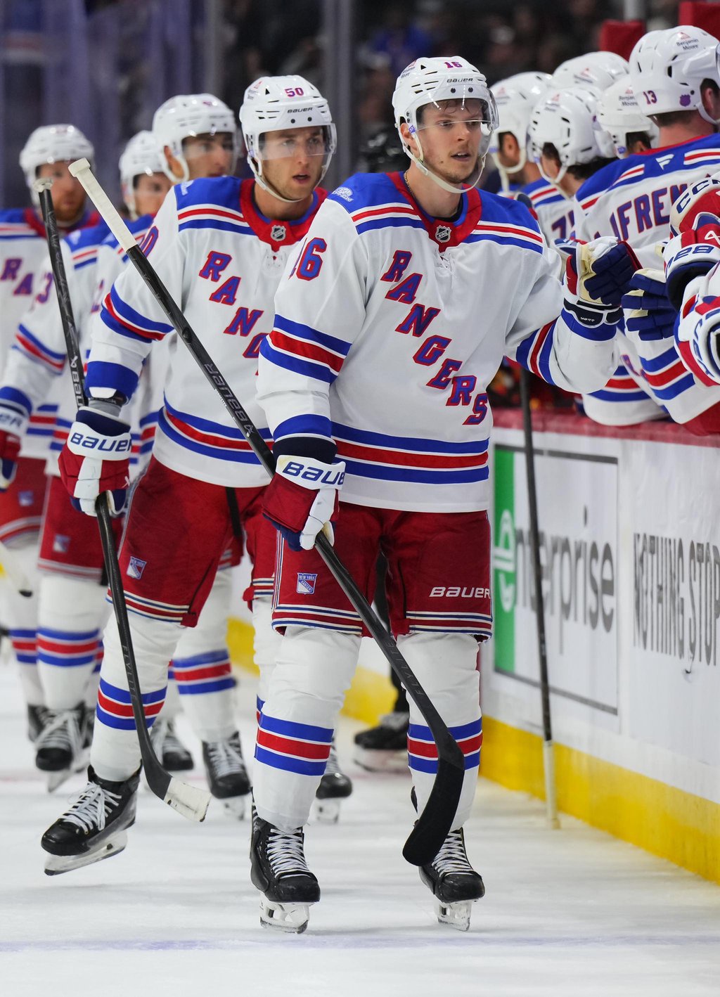 Pavel Dorofeyev celebrates his goal with teammates on the bench.