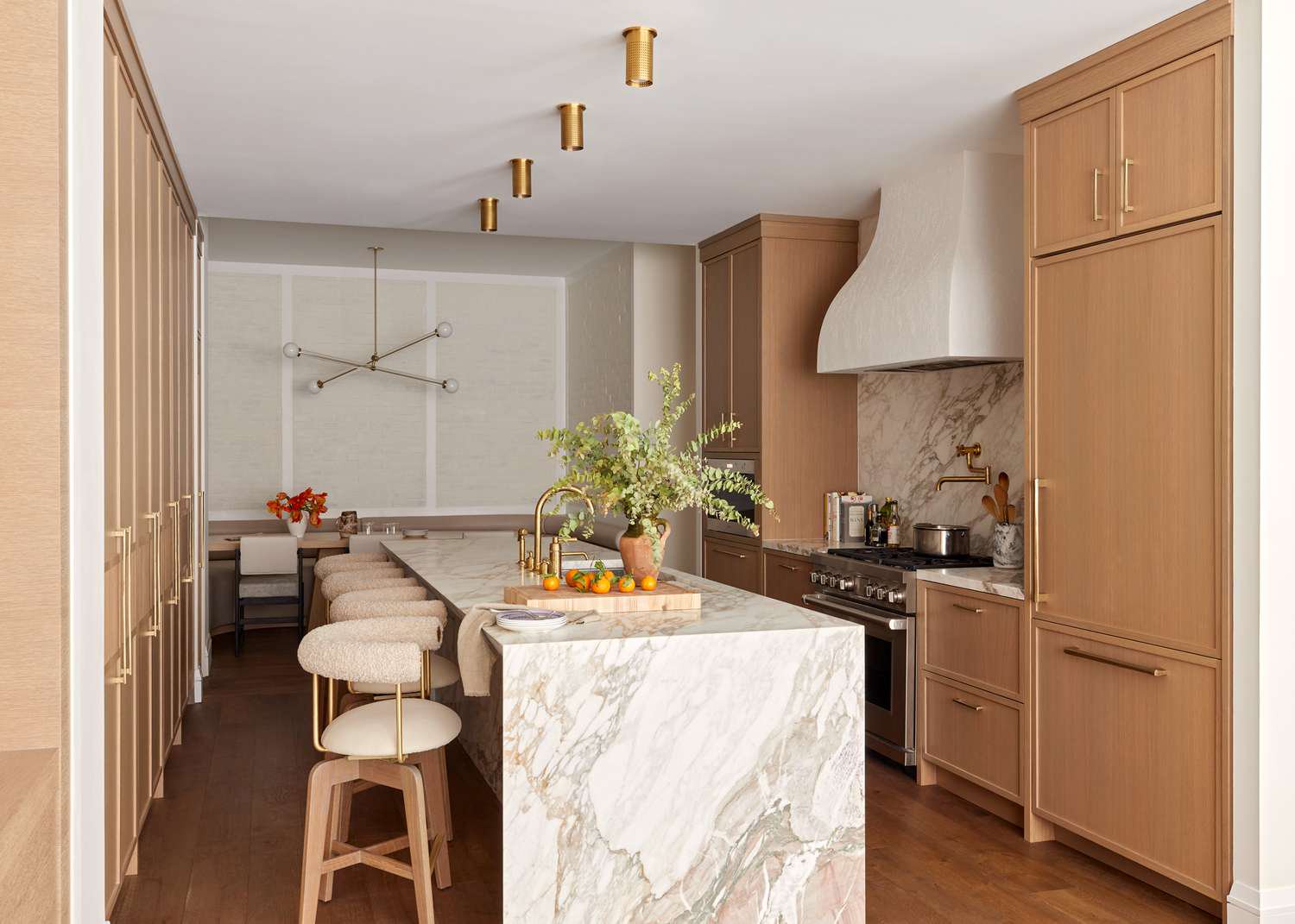 tall wooden cabinets and marble island