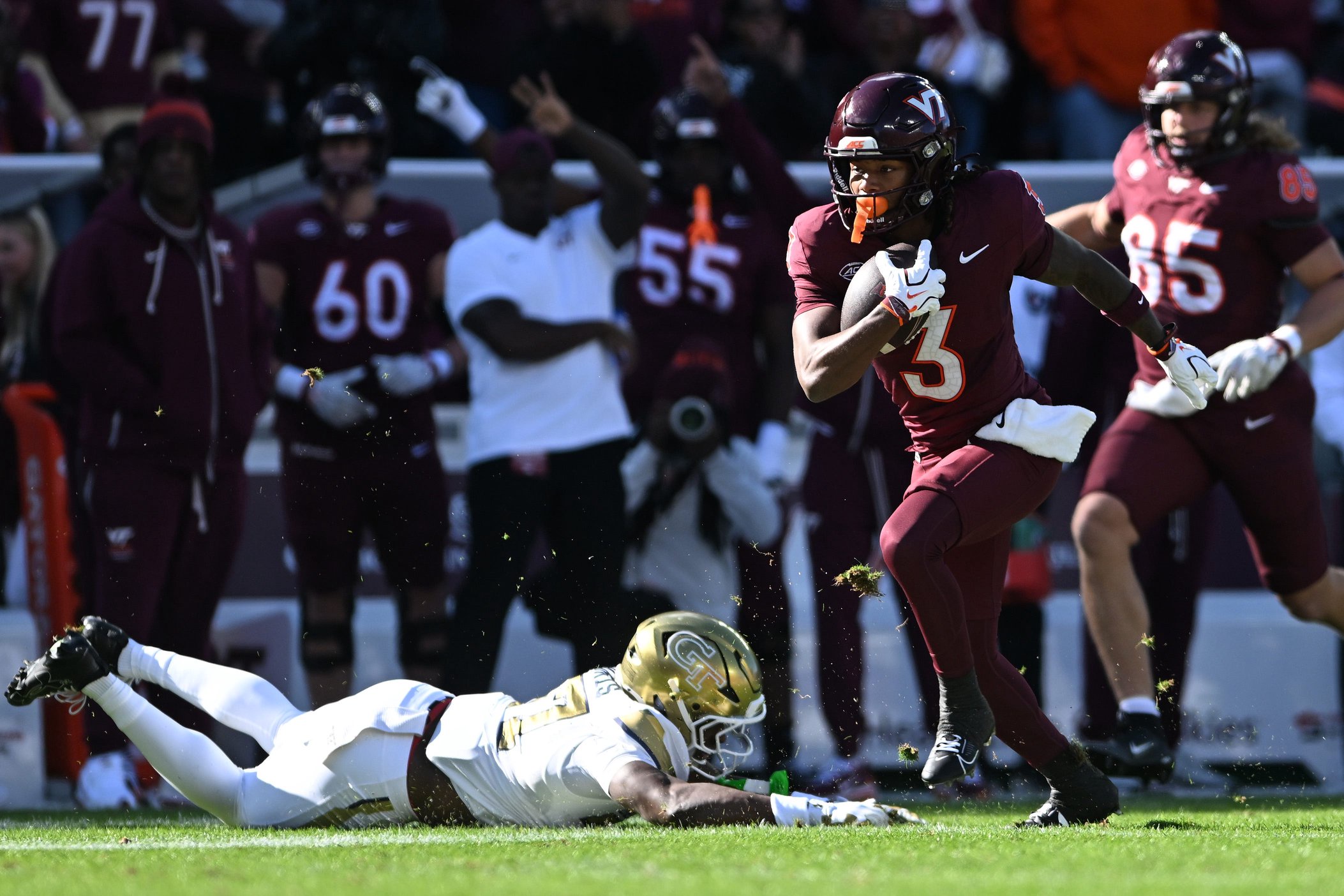 Que'sean Brown of the Virginia Tech Hokies carries the ball past Tae Harris of the Georgia Tech Yellow Jackets and scores a touchdown during the first quarter at Lane Stadium on October 17, 2026 in Blacksburg, Virginia.