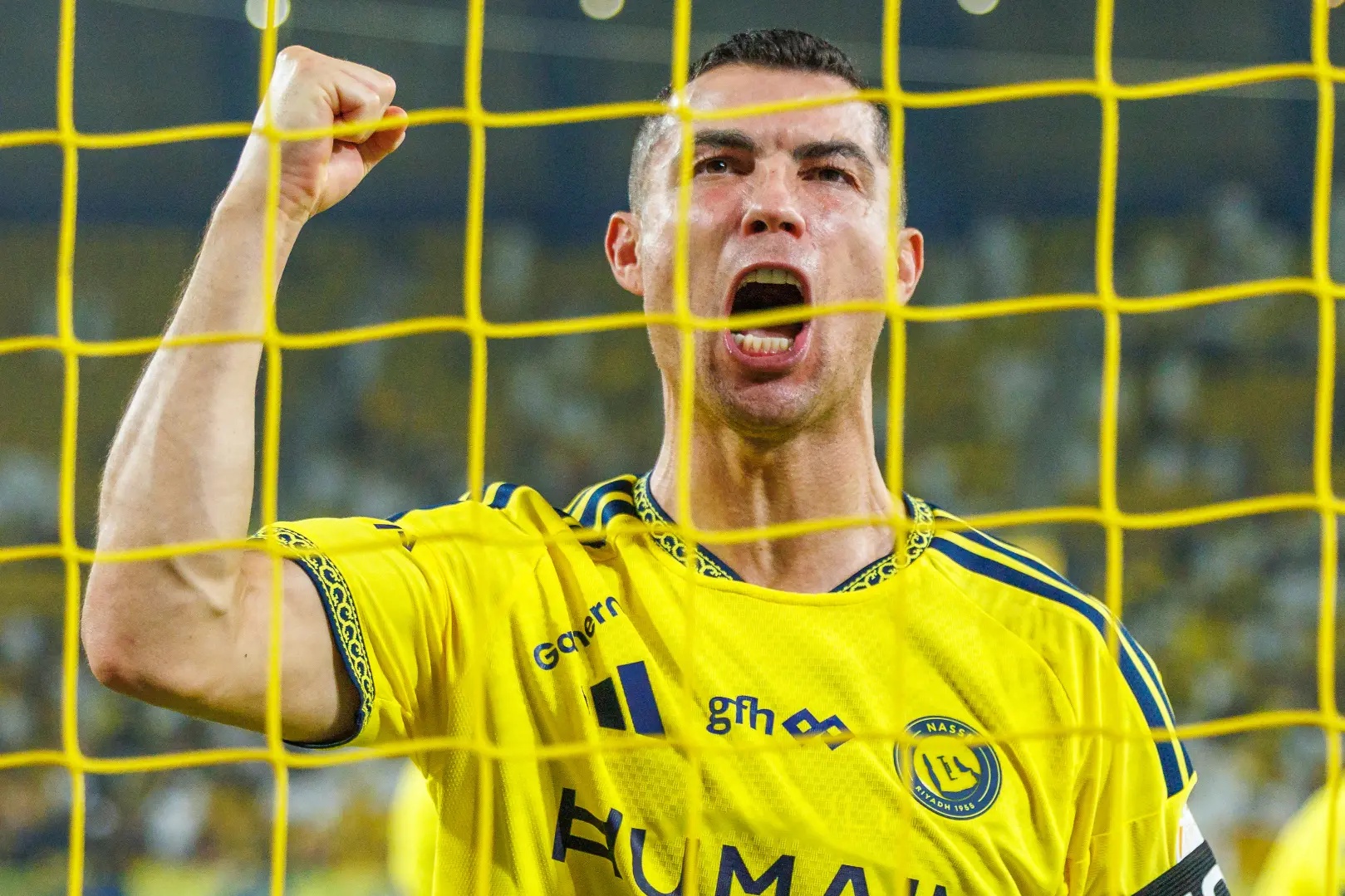 Cristiano Ronaldo celebrating in netting.