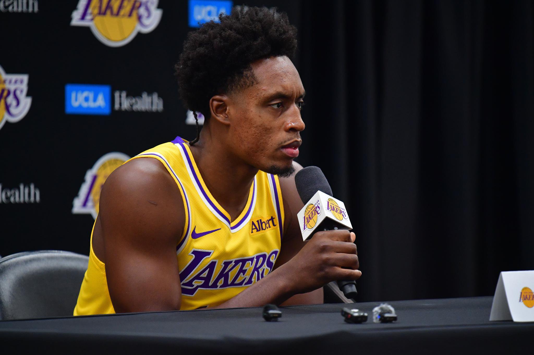 Los Angeles Lakers player Collin Sexton speaks into a microphone during media day.