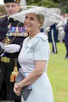 The Duchess's dress featured a large bow placed at the left shoulder. She opted for a dusky blue number