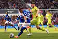 Omari Hutchinson of Ipswich Town shoots under pressure from Ben Jackson of Huddersfield Town during the Sky Bet Championship match between Ipswich ...