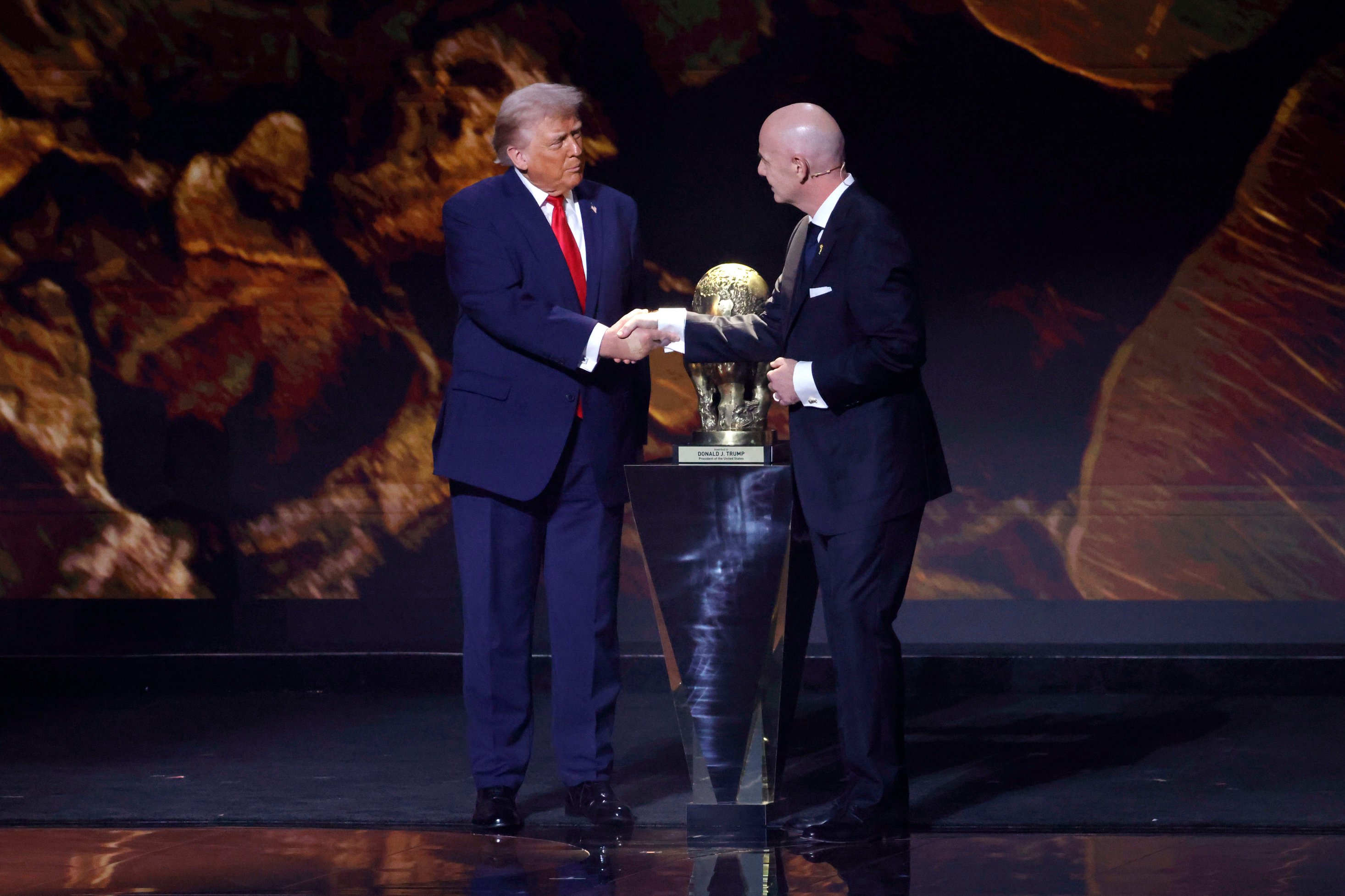 FIFA president Gianni Infantino presents United States President Donald Trump with the FIFA Peace Prize during the FIFA World Cup 2026 Final Draw at John F. Kennedy Center for the Performing Arts. 