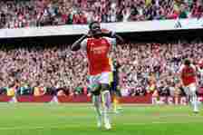 Bukayo Saka of Arsenal celebrates scoring a goal from the penalty spot during the Premier League match between Arsenal FC and AFC Bournemouth at Em...
