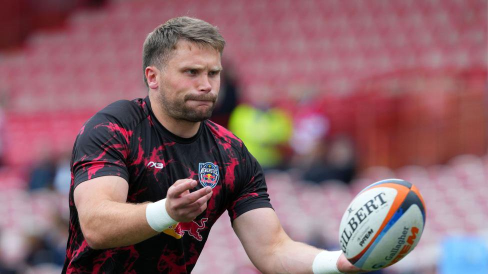 Ollie Leatherbarrow throwing the ball as he warms up ahead of a Newcastle Red Bulls match