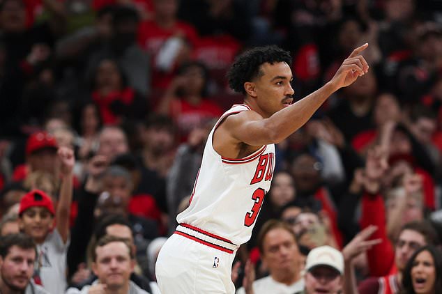 Chicago Bulls guard Tre Jones reacts after a three point basket during the first quarter of an NBA basketball game against the Washington Wizards, Saturday, Oct. 24, 2026, in Chicago. (AP Photo/Jessie Alcheh)