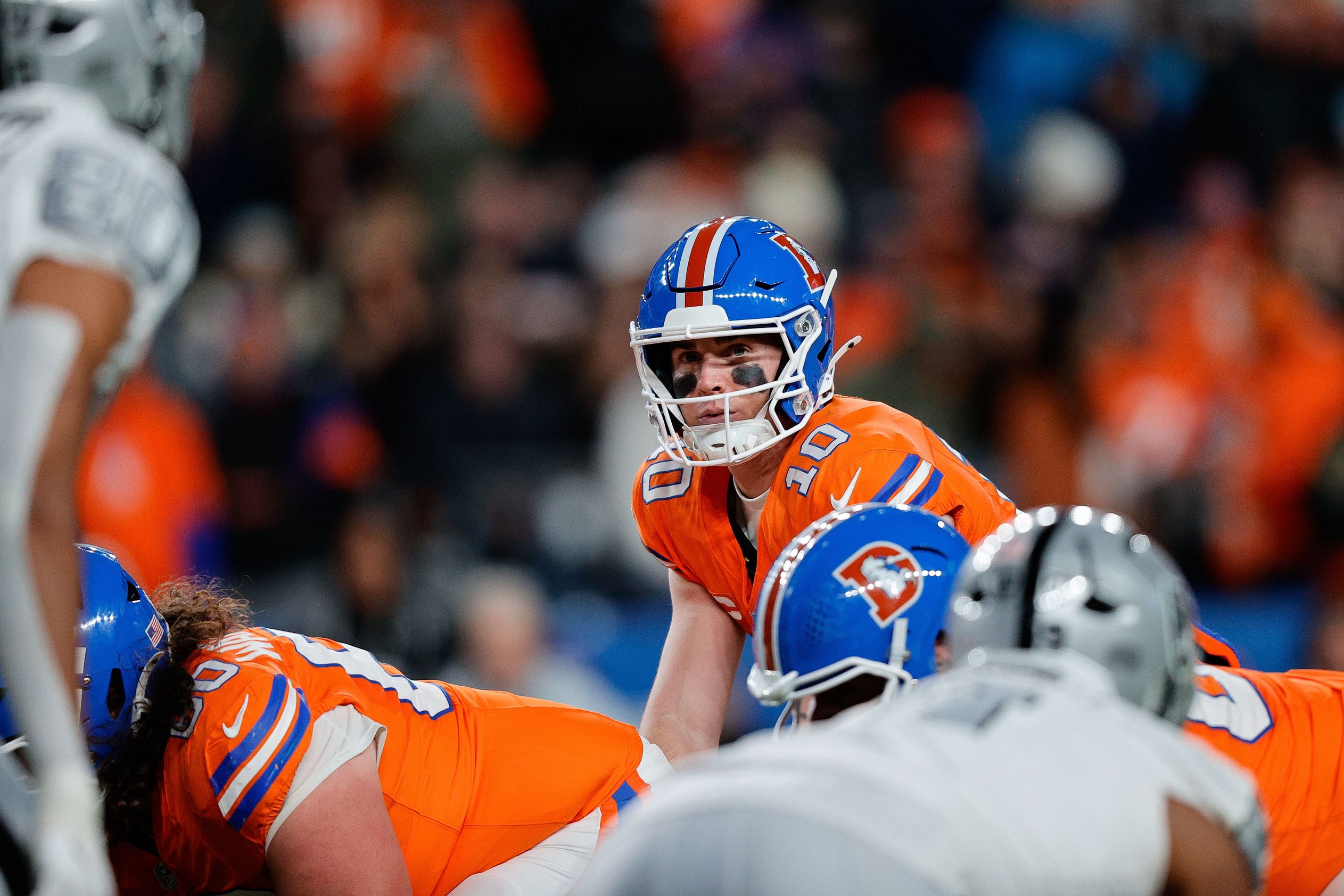 Nov 6, 2025; Denver, Colorado, USA; Denver Broncos quarterback Bo Nix (10) at the line of scrimmage in the fourth quarter aLas Vegas Raiders at Empower Field at Mile High. Mandatory Credit: Isaiah J. Downing-Imagn Images