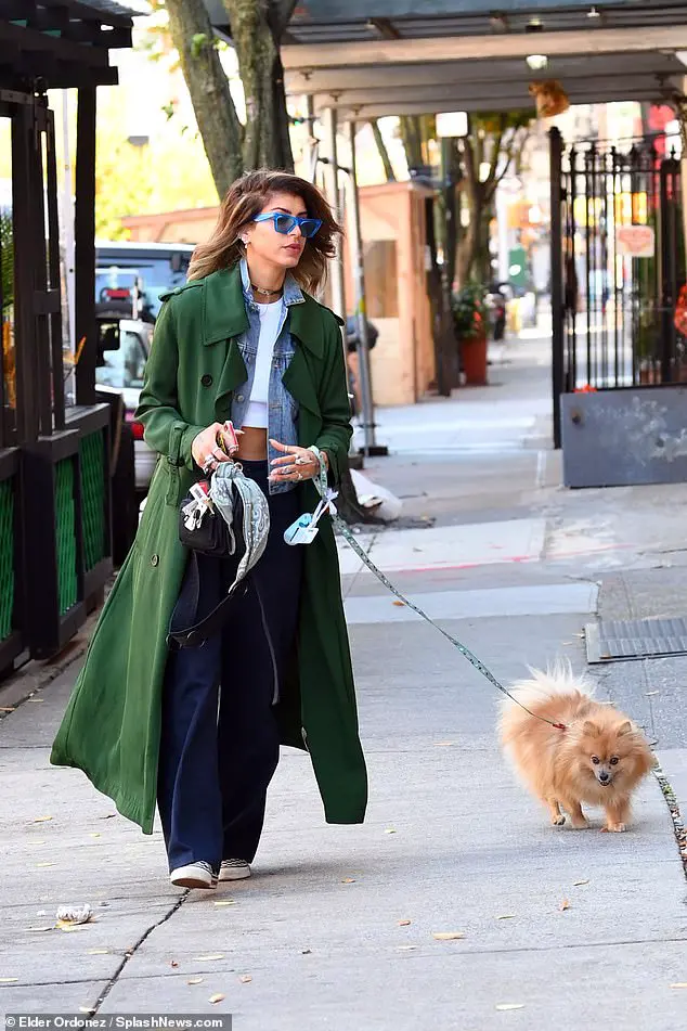 Photographs obtained exclusively by DailyMail.com show fashion designer Karim cutting a chic figure as she walked her small dog in the same city where she reportedly met Lentz back in May