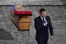 French President Emmanuel Macron leaves after paying his respects by the coffin of Samuel Paty in the courtyard of the Sorbonne university during a national memorial event, October 2020