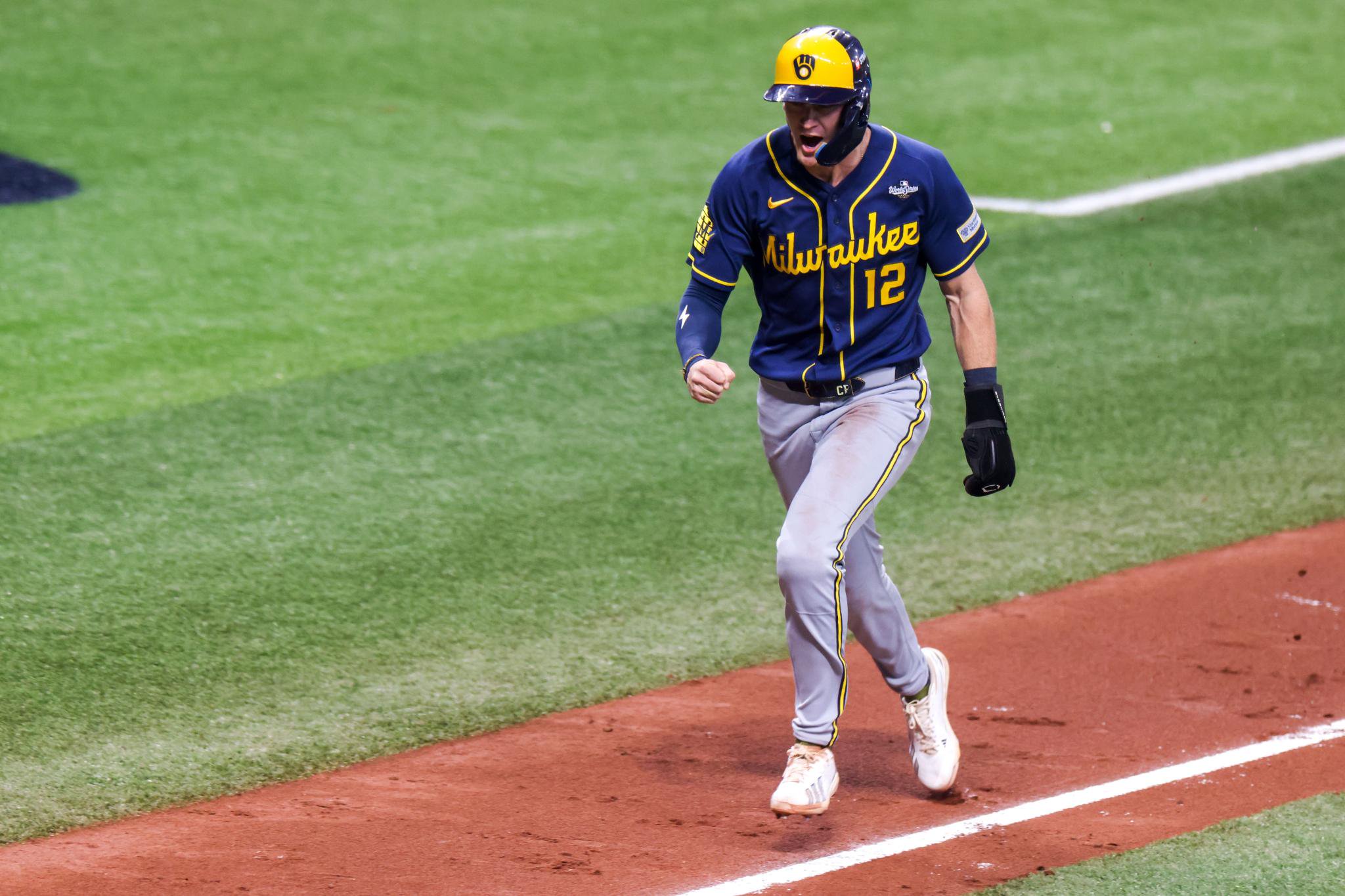 Milwaukee Brewers shortstop Cooper Pratt reacts while running home to score during Game 5 of the World Series against the Tampa Bay Rays at Tropicana Field.