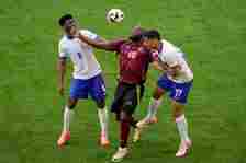 Belgium's Romelu Lukaku is challenged by Aurelien Tchouameni of France and William Saliba of France during a round of sixteen match between France and Belgium at the Euro 2024 soccer tournament in Duesseldorf, Germany, Monday, July 1, 2024. (AP Photo/Andreea Alexandru)