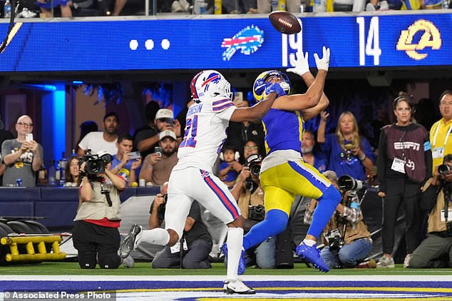 Los Angeles Rams wide receiver Puka Nacua, right, makes a touchdown catch as Buffalo Bills cornerback Davison Igbinosun defends during the second half of an NFL football game, Monday, Oct. 12, 2026, in Inglewood, Calif. (AP Photo/Gregory Bull)