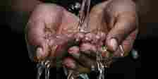 hands holding water