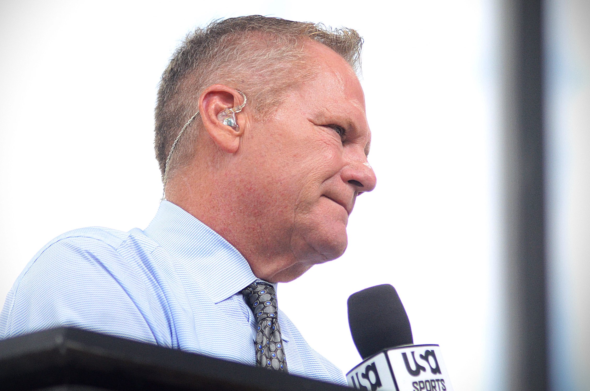 Marty Snider hosts USA Sports' pre-race show from atop a pit box at Charlotte Motor Speedway ahead of the Bank of America 400 on Sunday, Oct. 11, 2026.