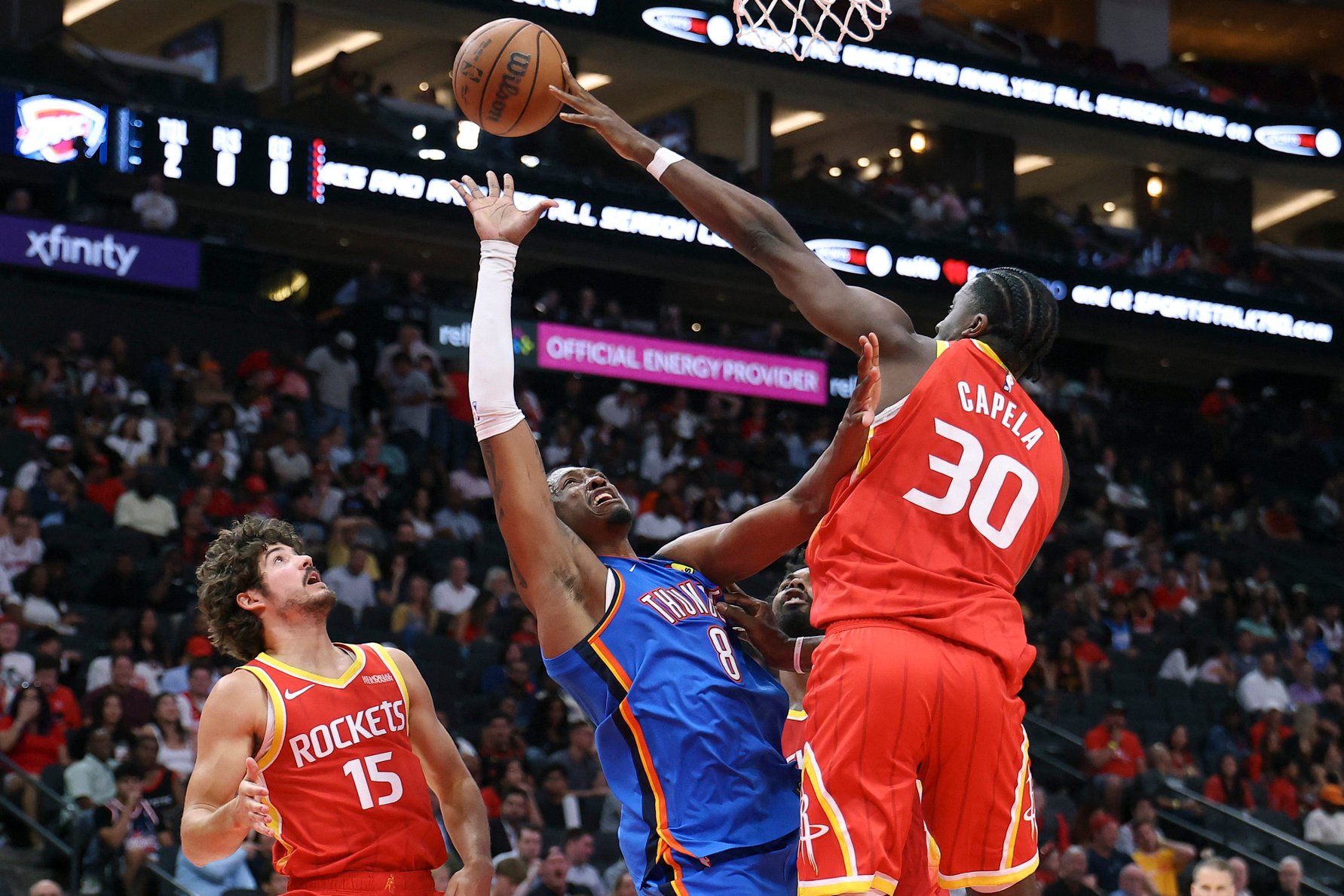 Oct 15, 2026; Houston, Texas, USA; Houston Rockets center Clint Capela (30) attempts to defend as Oklahoma City Thunder guard Jalen Williams (8) shoots the ball during the third quarter at Toyota Center. Mandatory Credit: Troy Taormina-Imagn Images