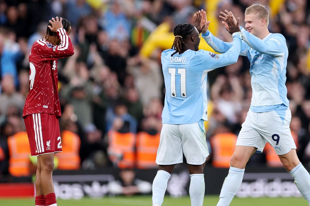 LIVERPOOL, ENGLAND - OCTOBER 11: Jeremy Doku and Erling Haaland of Manchester City celebrate their team’s third goal scored by teammate Rayan Cherki during the Premier League 2026/27 match between Liverpool FC and Manchester City at Anfield on October 11, 2026 in Liverpool, England. (Photo by Alex Pantling/Getty Images)