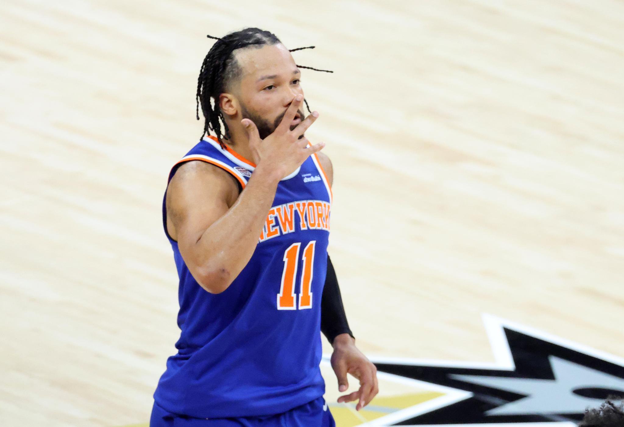 New York Knicks guard Jalen Brunson reacts after making a three-point shot against the San Antonio Spurs.