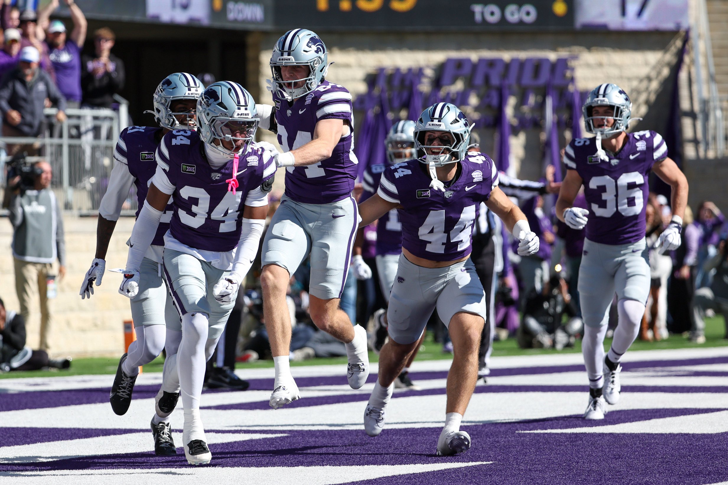 Oct 17, 2026; Manhattan, Kansas, USA;  Kansas State Wildcats cornerback Nick McClellan (34) is congratulated by teammates following a safety in the first quarter against the Kansas Jayhawks at Bill Snyder Family Football Stadium.  Mandatory Credit: Scott Sewell-Imagn Images
