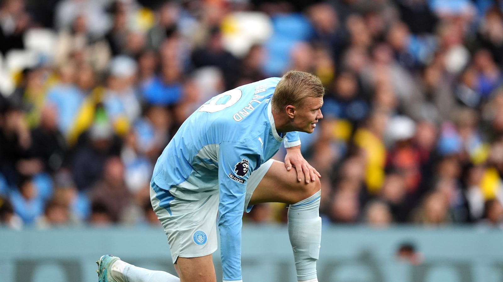 Manchester City’s Erling Haaland reacts to an injury