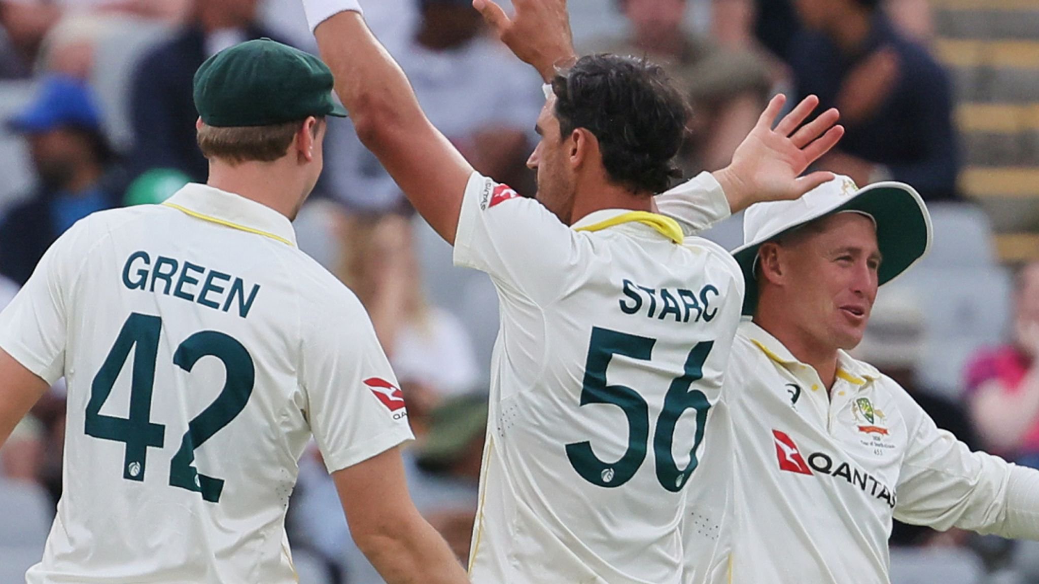 Mitchell Starc, center, celebrates after leading Australia's fightback on the opening day against South Africa 