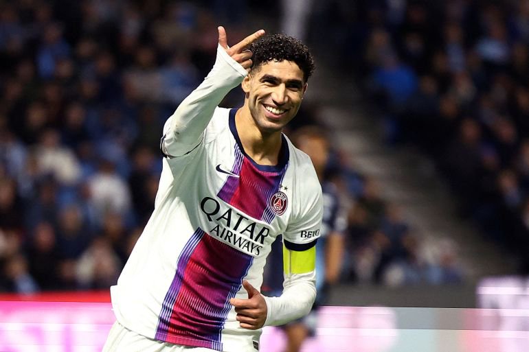 Paris St Germain's Achraf Hakimi celebrates.