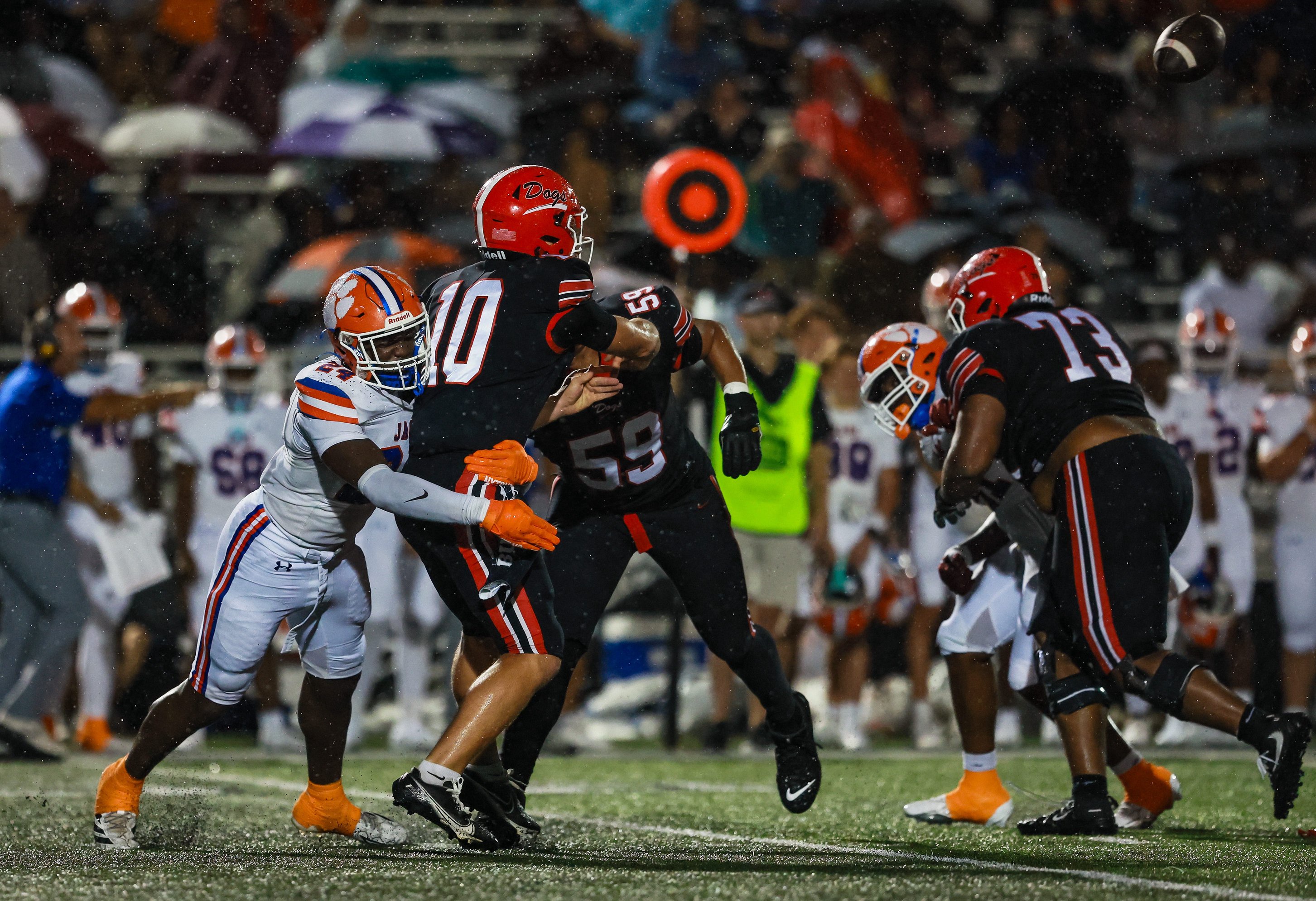 Madison Central Jaguars defender pressures Brandon Bulldogs quarterback Sladen Shack (10) during a game at Brandon High School in Brandon, Miss., on Friday, Sept. 4, 2026.