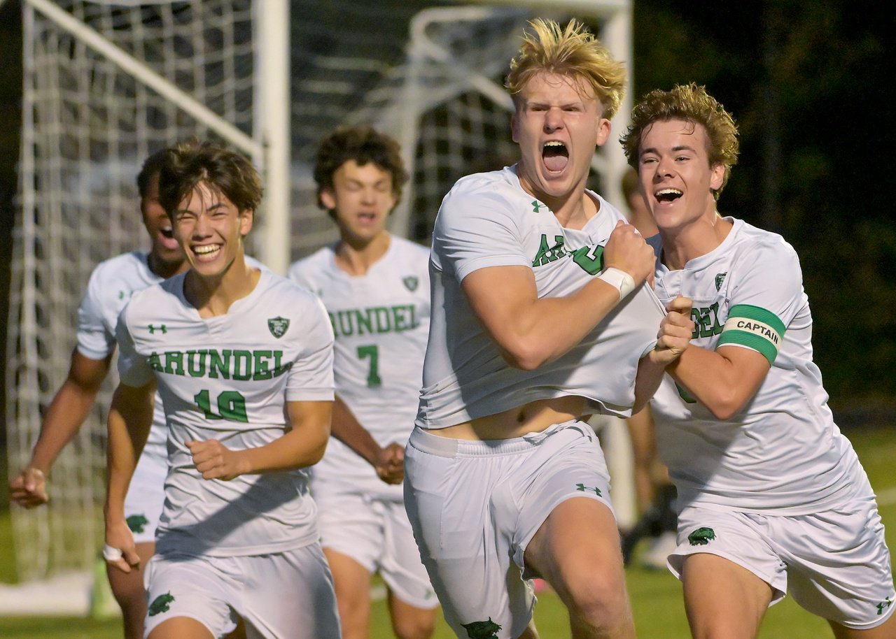Arundel Wildcats Eli Johnstone-Clark #24 celebrates with teammates after scoring during the first half. The visiting Arundel Wildcats defeat the South River Seahawks, 2-1, in overtime in an MPSSAA Class 3A East II quarterfinal boys soccer game Wednesday evening. (Paul W. Gillespie/Staff)