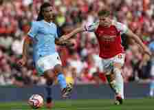 Manchester City's Dutch defender #06 Nathan Ake (L) vies with Arsenal's Norwegian midfielder #08 Martin Odegaard (R) during the English Premier Lea...