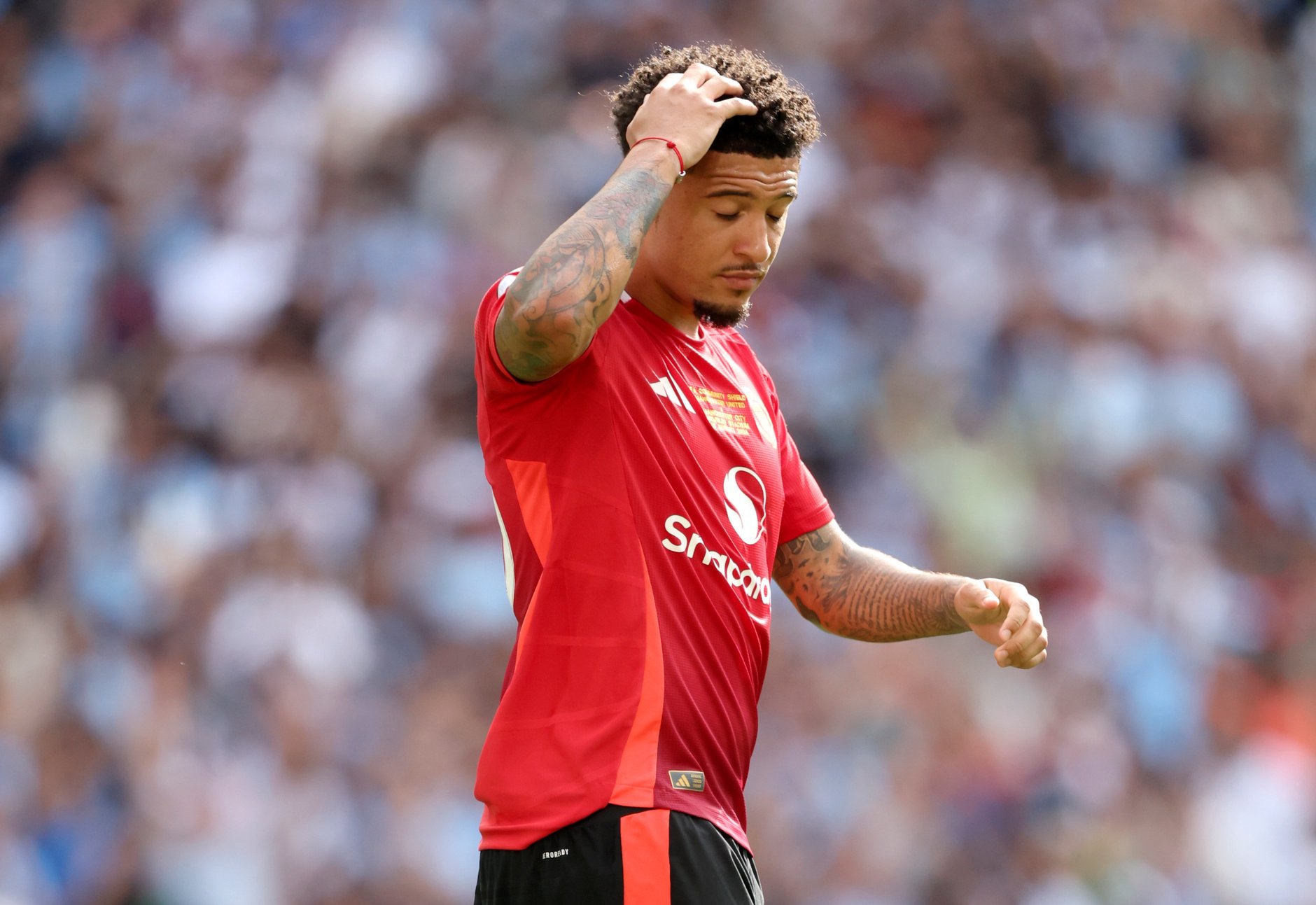 Jadon Sancho looks dejected after missing a penalty during the 2024 Community Shield