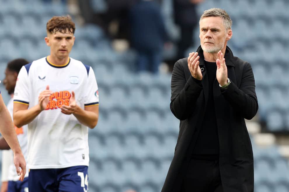 Preston North End manager Graham Alexander applauds the fans at the final whistle