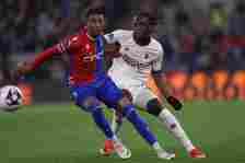 Crystal Palace's French midfielder #07 Michael Olise (L) vies with Manchester United's English defender #29 Aaron Wan-Bissaka (R) during the Englis...