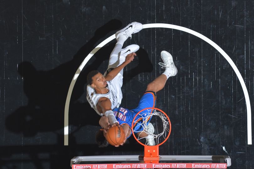 Aday Mara #15 of the Oklahoma City Thunder blocks the shot of Victor Wembanyama #1 of the San Antonio Spurs
