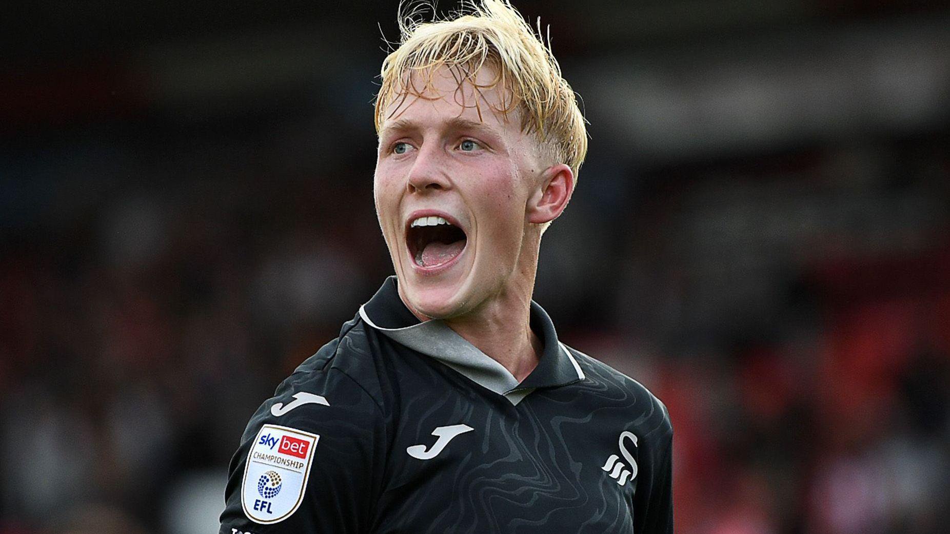 Melker Widell celebrates a Swansea goal 