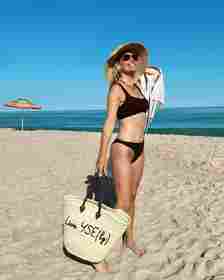 Molly Sims in a bikini on the beach