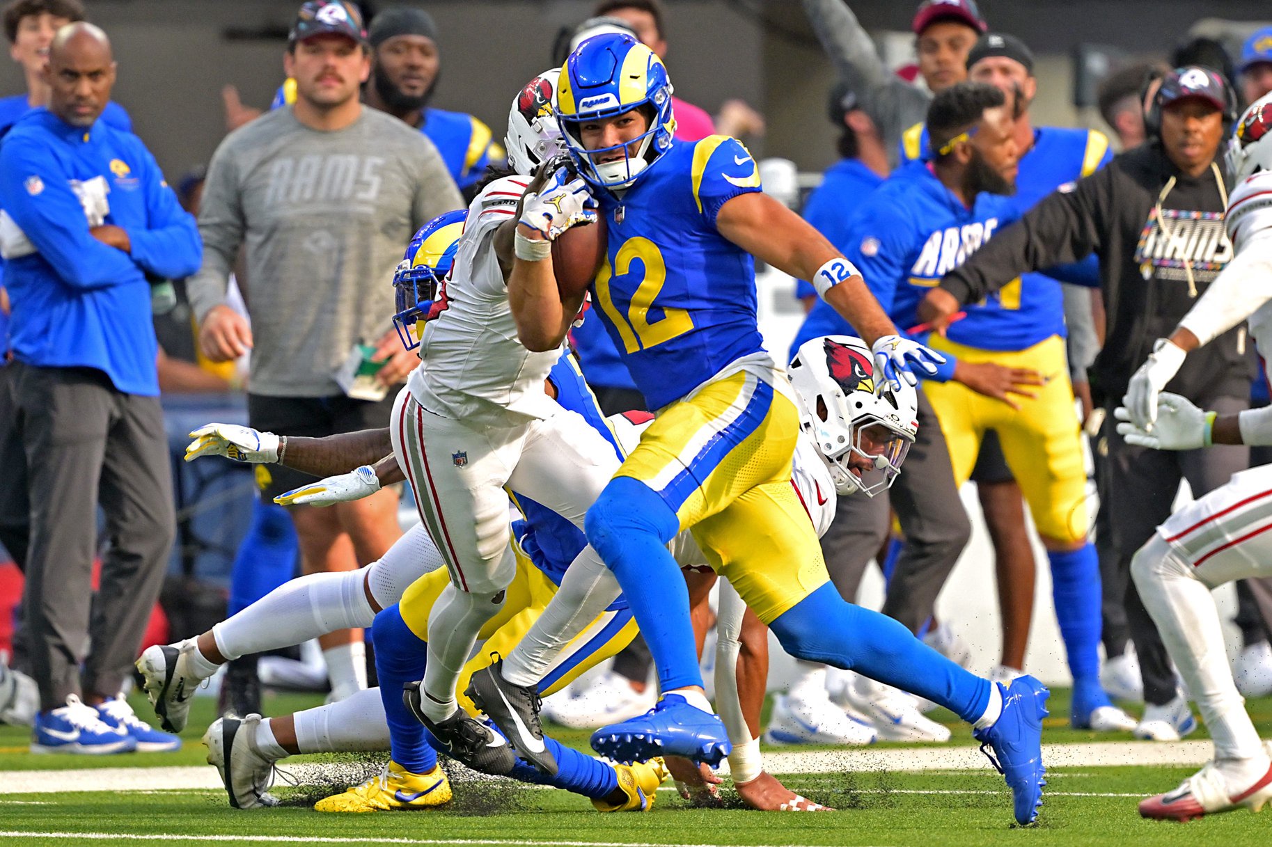 Los Angeles Rams wide receiver Puka Nacua (12) runs for 22 yards after a complete pass against the Arizona Cardinals at SoFi Stadium. 